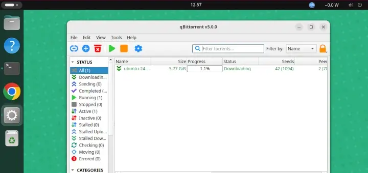 Torrent client interface downloading and seeding an official Linux installation ISO with visible progress and peer information.